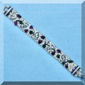 J04. 14K Gold, diamond and gemstone bracelet. 